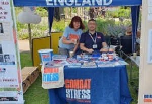 Photo of Christopher Auker-Howlett and Janet Murden (GCN Volunteer) manning the Combat Stress stall in Cheltenham, 2019